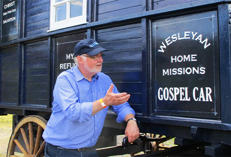 Mark Rudall, Waterways Chaplain beside Gospel Car at Black Country Museum