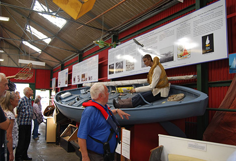 Members looking at Airborne Lifeboat at the Museum of the Broads
