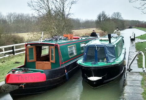 narrowboats doubled up to get through a lock