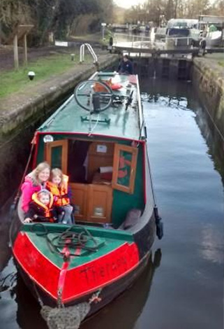 Narrowboat with young family aboard