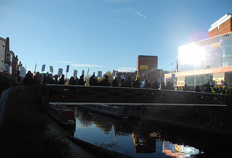 boaters' march crosses canal bridge in Birmingham