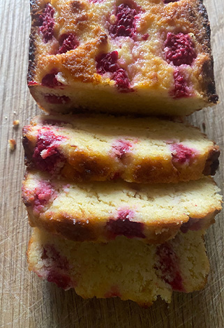 sliced lemon and raspberry polenta cake