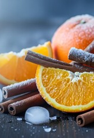 frosted oranges with cinnamon sticks