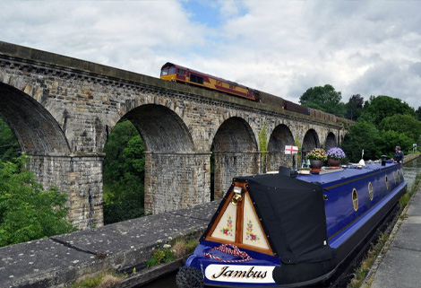 Chirk Aqueduct and Viaduct narrowboat and train at Chirk