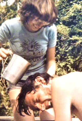 girl washing a young man's hair