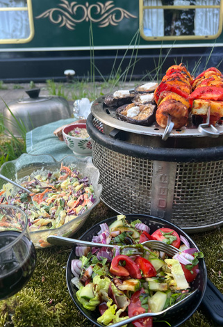 Skewers cooking on Cobb BBQ