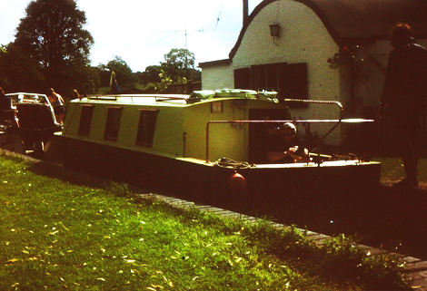 narrowboat by lock-keepers cottage