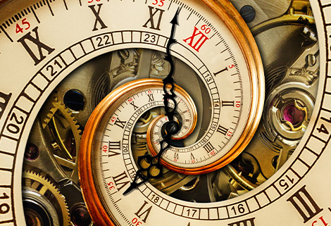 narrowboat time - CanalsOnline Magazine Close-up of a vintage mechanical clock with spiraling Roman numeral dials and visible gears.